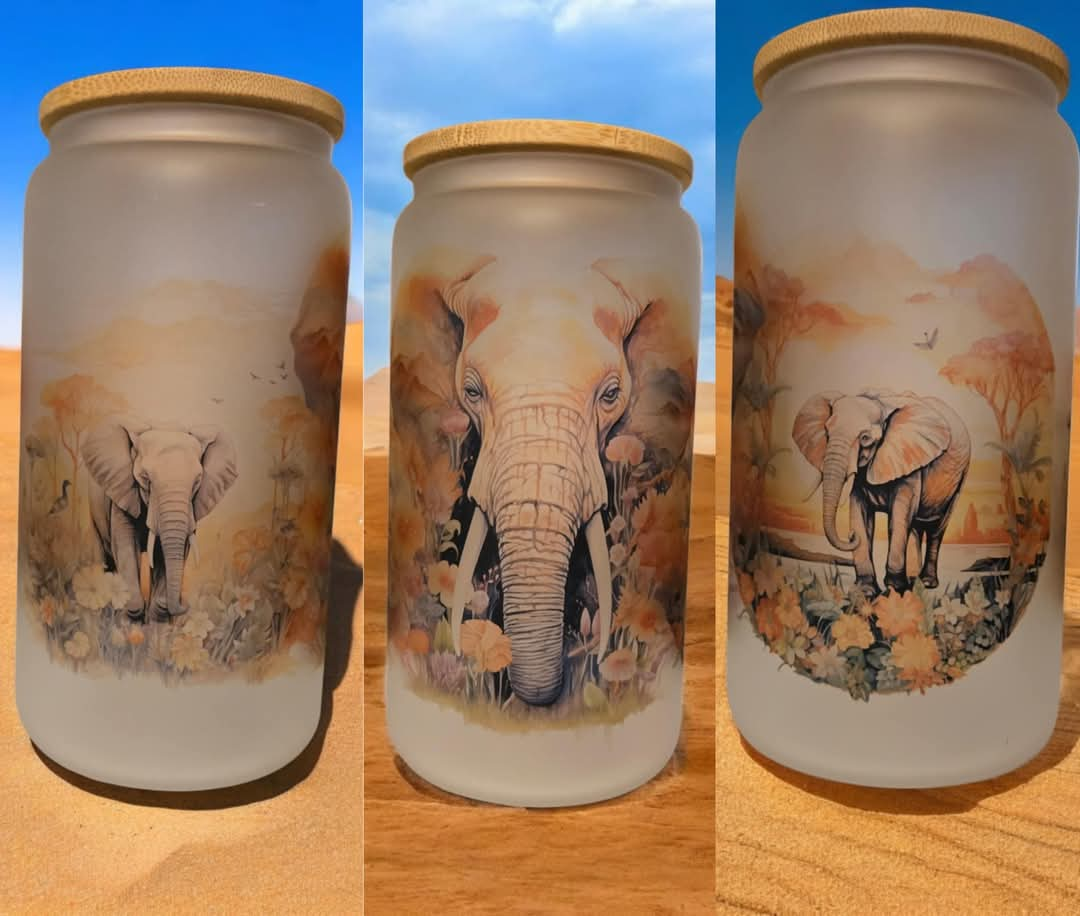 Elephants 16oz frosted glass cup with bamboo lid and a straw.